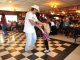 TJ Sacco dances with a fan