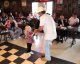 TJ Sacco dances with a fan